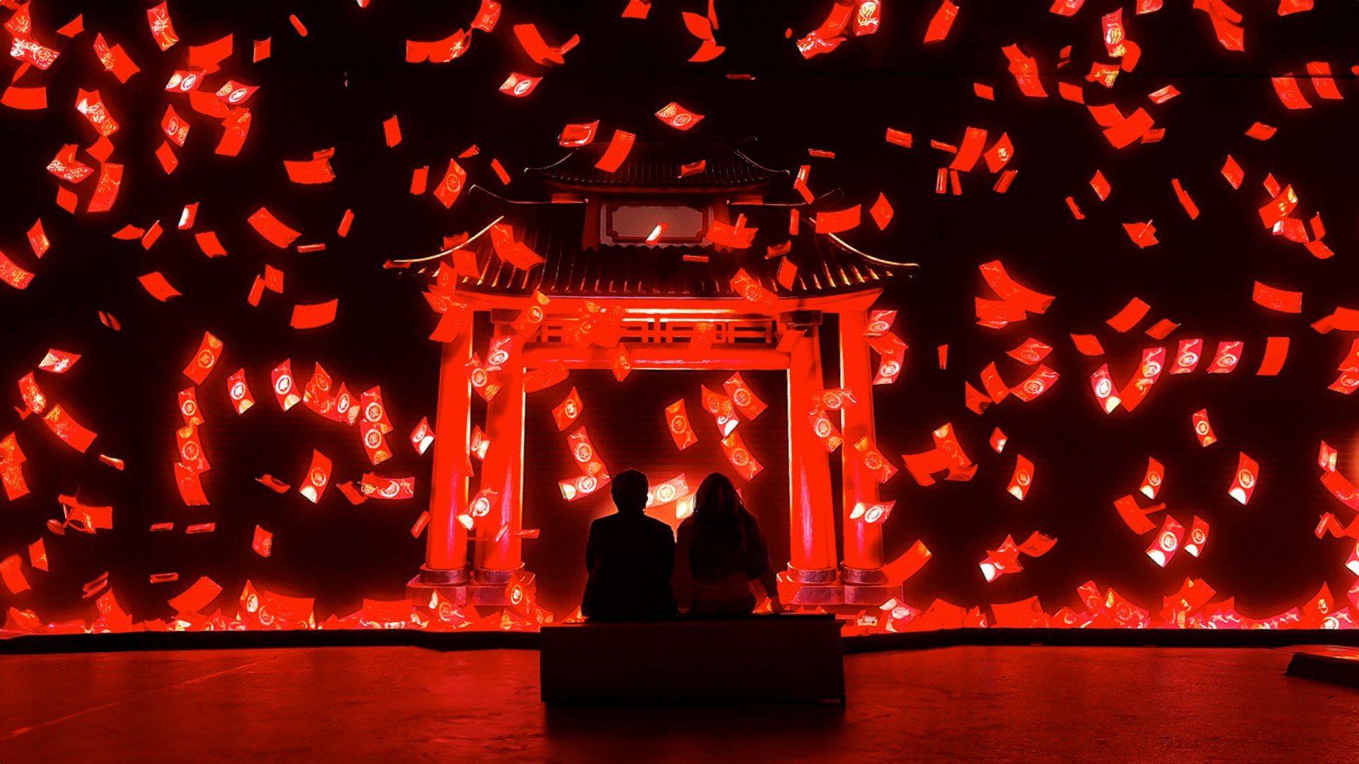 Two guests sit before a glowing red gateway and floating lanterns in Mythos